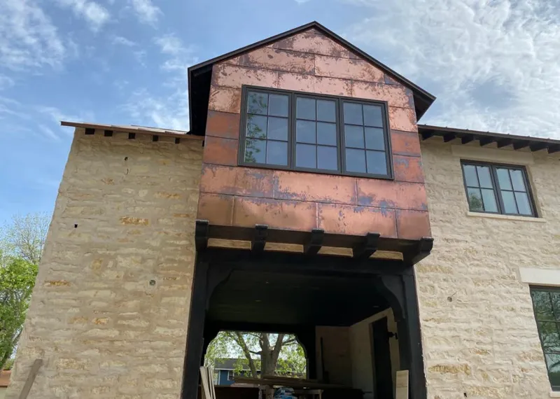 Copper metal panel facade on a stone building for Skylight Installation in Alum Rock